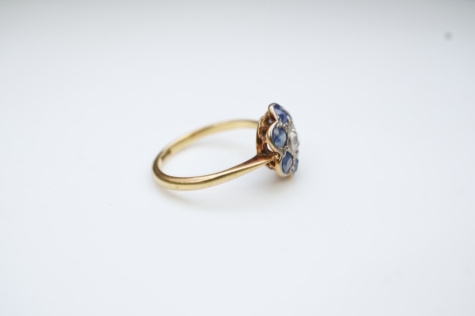 A sapphire and diamond cluster ring, early 20th century